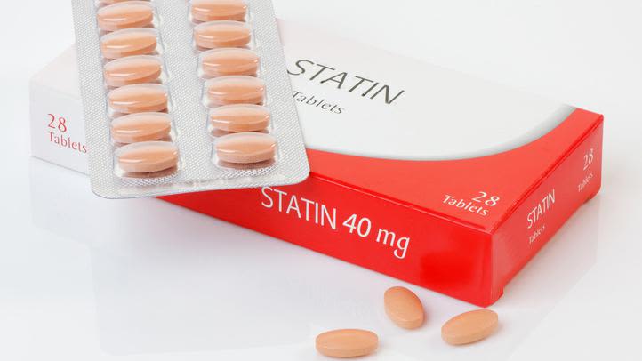 A box of statin tablets and a blister pack of tablets.