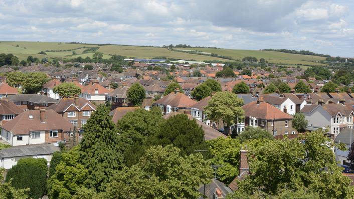 Aerial view of English town and surrounding countryside.